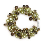 Light and dark green pearls, olivine crystals, smokey quartz pebbles and faceted beads[381]