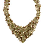 Green and  light green pearls, peridots and olivine crystals[604]