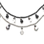 Black and silver glass beads, onyx, black pearls, clear quartz and silver charms.[8115]